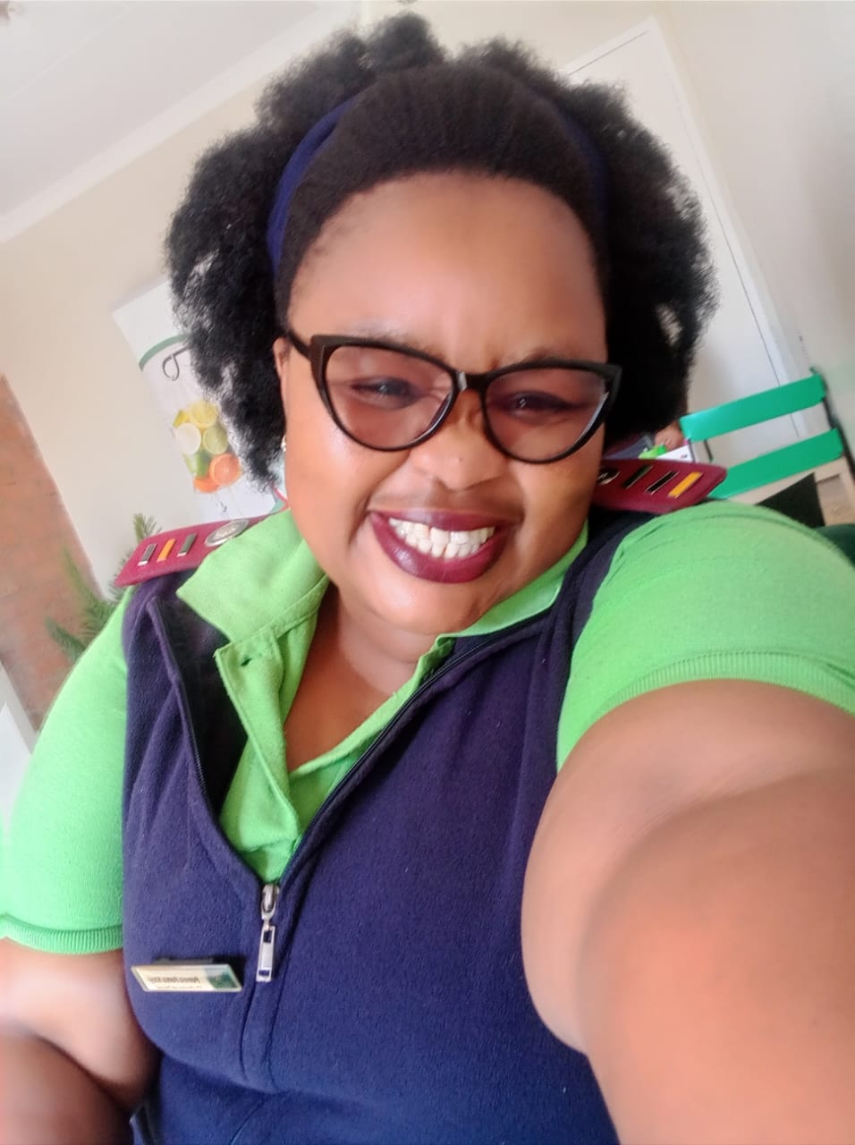 Sr. Pumela Nteyi in green uniform